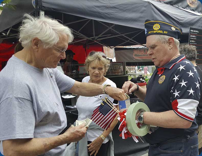 Danny Barnes offering Poppies and Flags at Paddle & Pour
